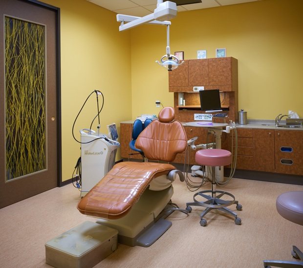 Pediatric dental treatment room with a cushioned chair